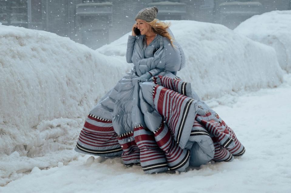 Carrie (Sarah Jessica Parker) makes her way through a bomb cyclone wearing a Moncler x Valentino coat. 