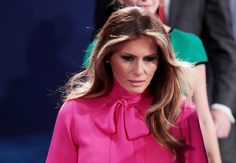 Melania Trump wears a bright pink pussybow to the second Presidential debate — after her husband's controversial remarks about grabbing women's genitals. (Photo: Getty)