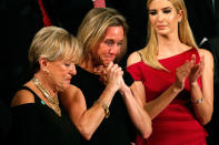 <p>President Trump Addresses Joint Session of Congress – Washington, U.S. – 28/02/17 – Carryn Owens (C), widow of Senior Chief Petty Officer William “Ryan” Owens, applauds with Ivanka Trump (R), daughter of U.S. President Donald Trump, after being mentioned by President Trump. (Kevin Lamarque/Reuters) </p>