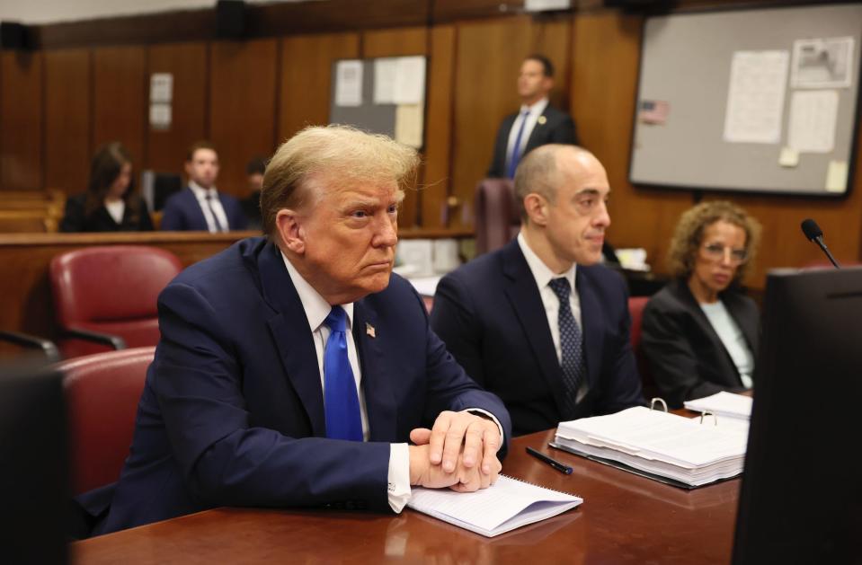 Former President Donald Trump appears alongside his attorneys at Manhattan criminal court during jury selection in his hush-money trial on April 18, 2024.