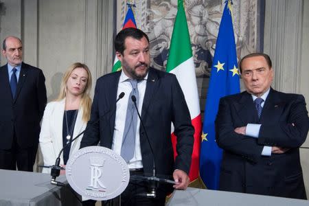 League party leader Matteo Salvini (C) speaks next to President of Fratelli d'Italia party (Brothers of Italy) Giorgia Meloni (L) and Forza Italia leader Silvio Berlusconi following a talk with Italian President Sergio Mattarella at the Quirinale palace in Rome, Italy, May 7, 2018. Italian Presidential Press Office/Handout via REUTERS