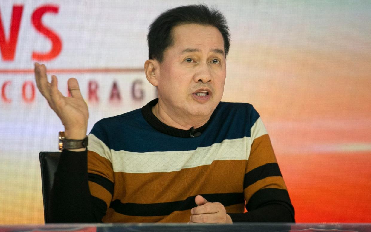 Mr Quiboloy speaking on a talk show, wearing a sweater