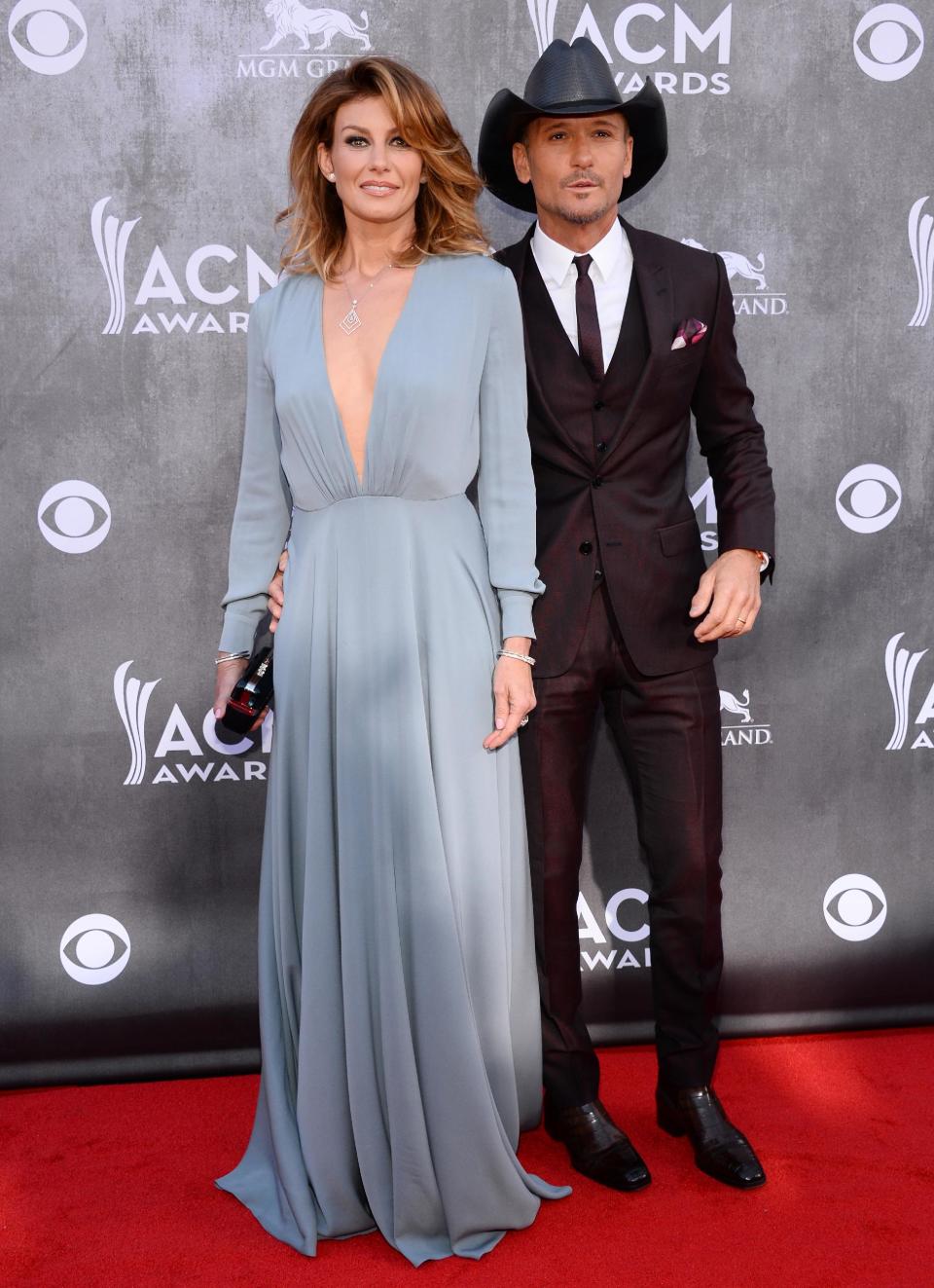 Faith Hill, left, and Tim McGraw arrive at the 49th annual Academy of Country Music Awards at the MGM Grand Garden Arena on Sunday, April 6, 2014, in Las Vegas. (Photo by Al Powers/Powers Imagery/Invision/AP)