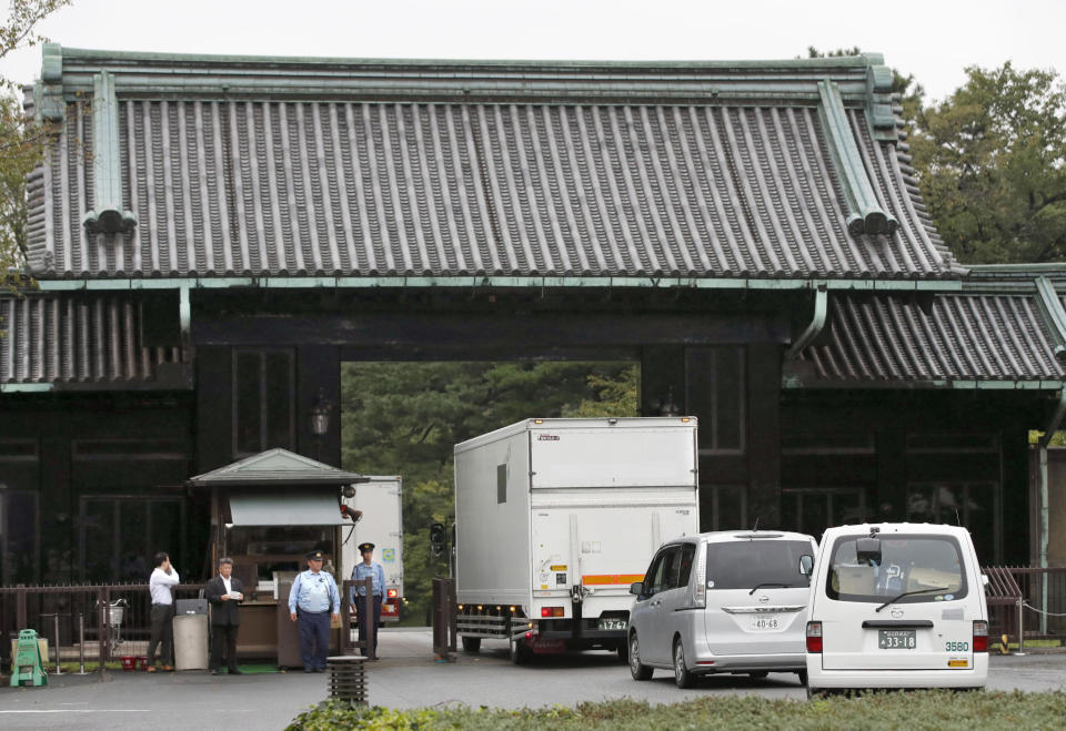 Trucks carrying parts of Takamikura throne enter a gate of the Imperial Palace in Tokyo upon arrival from the Kyoto Imperial Palace Wednesday, Sept. 26, 2018. The special imperial throne for the coronation of Japan’s new emperor arrived in Tokyo from the ancient imperial palace in Kyoto more than a year ahead of time. The Takamikura throne will be used at a ceremony in October 2019 when Crown Prince Naruhito formally announces his succession. (Kyodo News via AP)