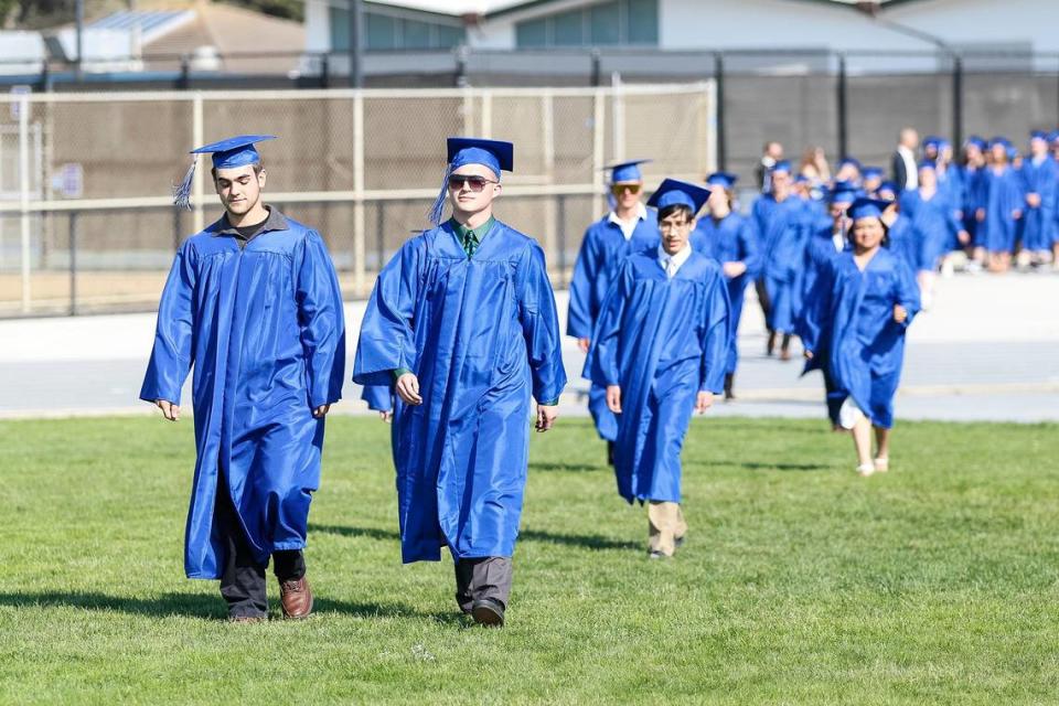 At Morro Bay High School, 180 grads were honored Thursday evening in a ceremony at the school’s football field. Morro Bay students walk onto the football field, June 8, 2023.