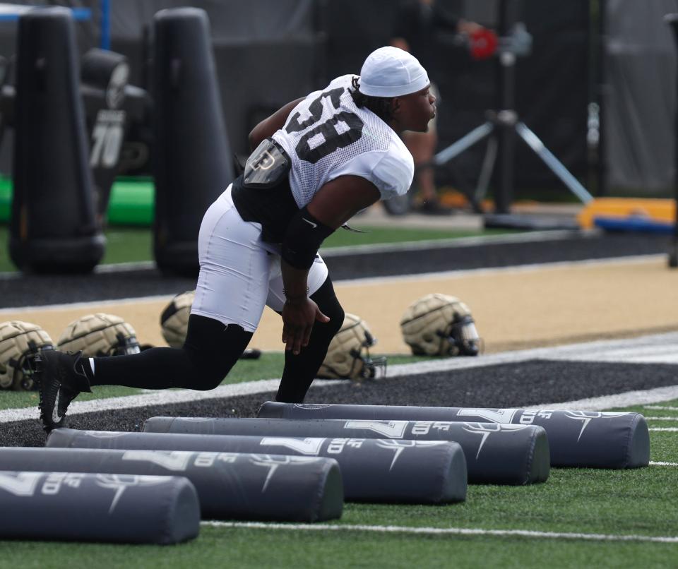 Purdue Boilermakers defensive tackle Branson Deen (58) runs a drill during a practice, Saturday, Aug. 6, 2022, at Purdue University in West Lafayette, Ind. 