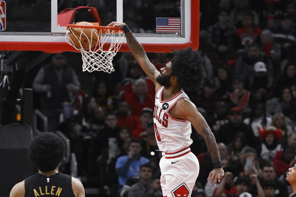 Chicago Bulls guard Coby White dunks against the Cleveland Cavaliers during the first half of an NBA basketball game, Saturday, Dec. 23, 2023, in Chicago. (AP Photo/Matt Marton)