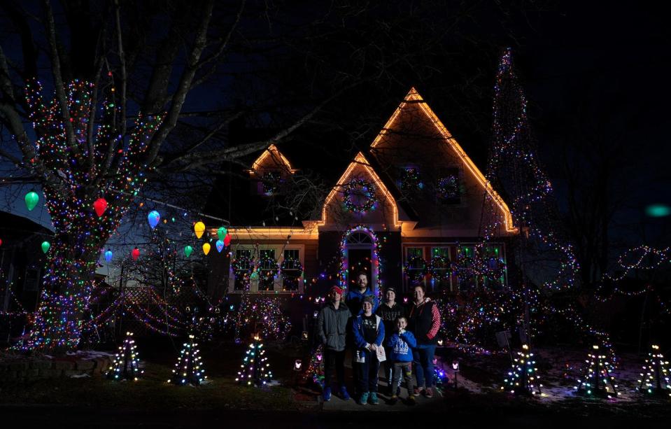 The Giroux family of East Providence with the holiday decorated home on Dec 13, 2022.  Left to right Harrison, Brian (Dad), Jude, Sophie, Flynn and Marsha (Mom). 