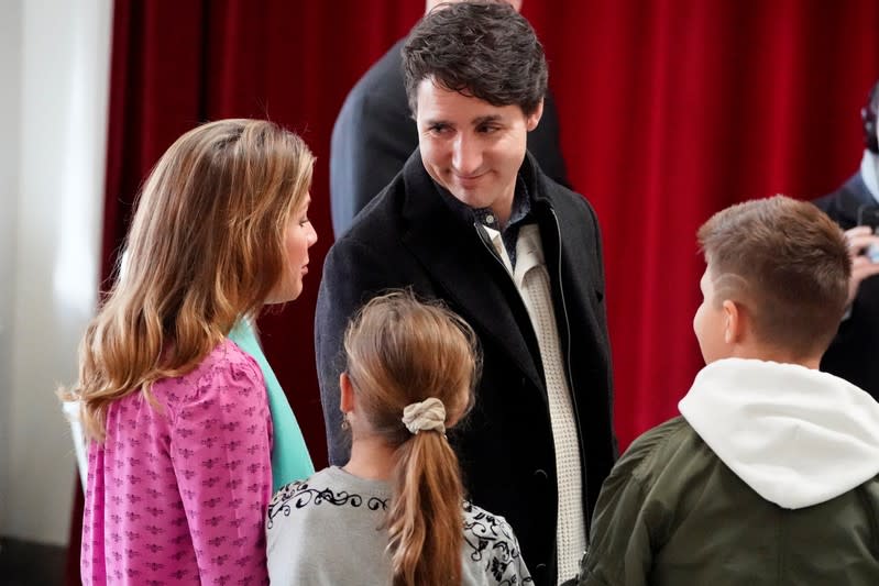 Justin Trudeau, with his family, arrives to cast his ballot for today's election in the Papineau area of Montreal