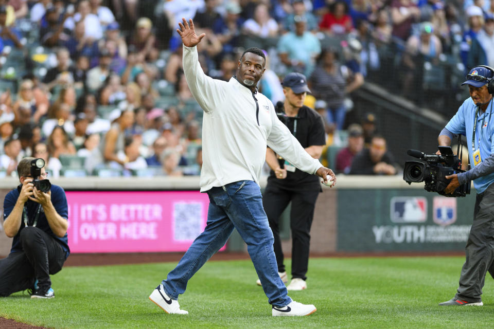 Major League Baseball Hall of Fame player Ken Griffey Jr., center, waves to the crowd as he is introduced before the HBCU Swingman Classic baseball game during All-Star Week, Friday, July 7, 2023, in Seattle. (AP Photo/Caean Couto)