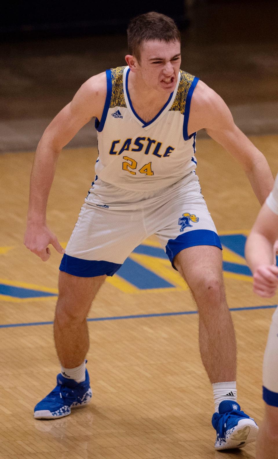 Castle’s Weston Aigner (24) celebrates a basket against Henderson County during their game at Castle High School Tuesday night, Jan. 18, 2022.