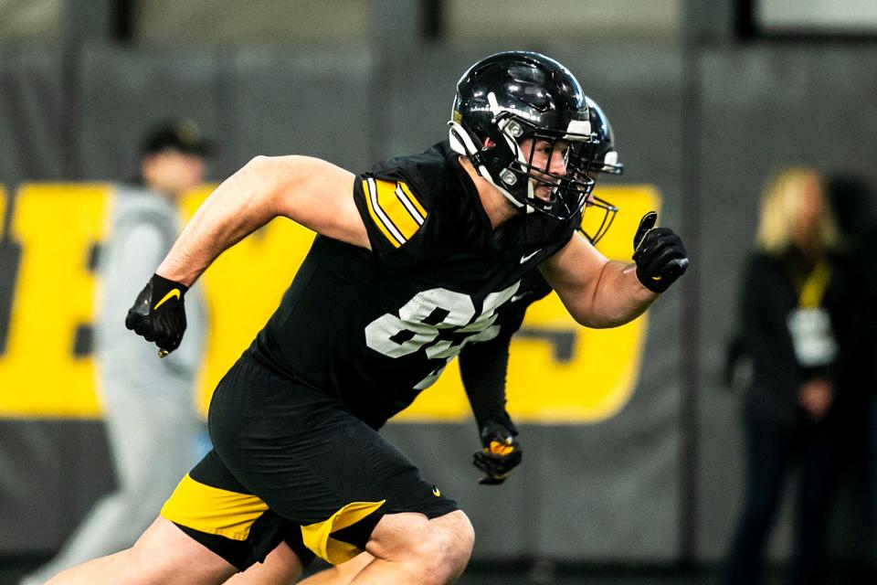 Iowa tight end Luke Lachey (85) runs a route during a spring NCAA football practice, Thursday, March 30, 2023, at the University of Iowa Indoor Practice Facility in Iowa City, Iowa.