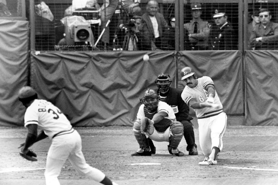 FILE - Oakland Athletics Sal Bando slams a double to center field in the sixth inning to score teammate Allan Lewis and the winning run in the final game of World Series against Cincinnati Reds in Cincinnati, Ohio, on, Oct. 22, 1972. Bando, a three-time World Series champion with the Oakland Athletics and former Milwaukee Brewers executive, died Friday night, Jan. 20, 2023, in Oconomowoc, Wis., according to a statement from his family. He was 78. (AP Photo/File)