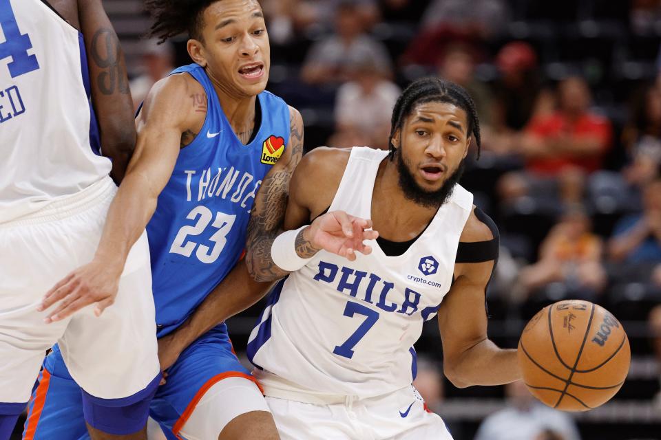 Philadelphia 76ers guard Isaiah Joe (7) drives past Oklahoma City Thunder guard Tre Mann (23) during the second half of an NBA summer league basketball game Thursday, July 7, 2022, in Salt Lake City.