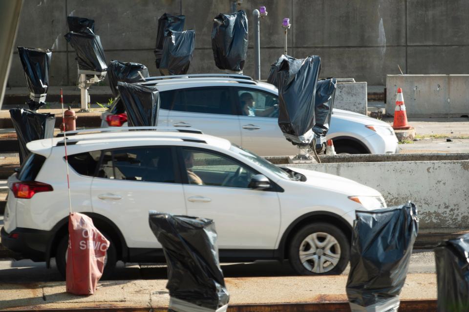 George Washington Bridge tolls are cashless and the carpool discount is eliminated as of Sunday, July 10, 2022. Plastic bags cover the outdated equipment used for collecting tolls from vehicles crossing the GWB Monday.