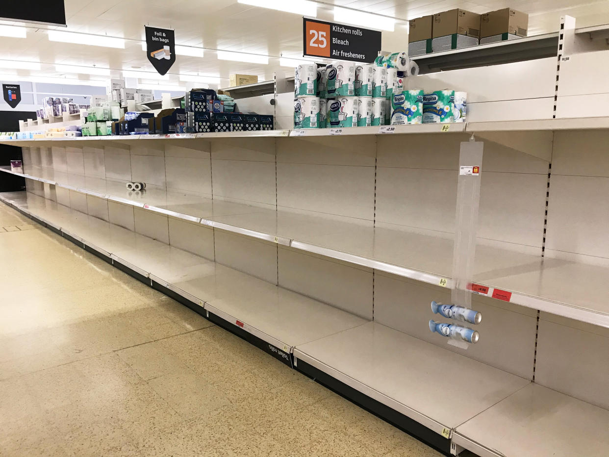 Empty toilet roll shelves in a Sainsbury's store in Basingstoke on Saturday. (PA)