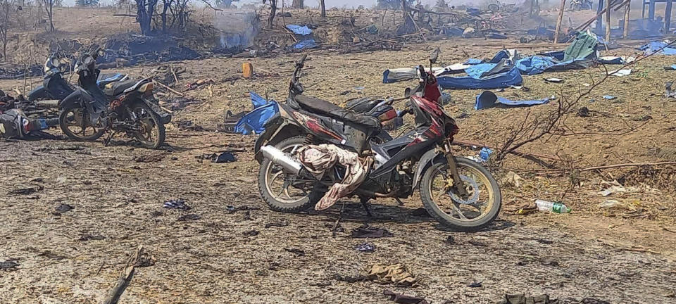This photo provided by the Kyunhla Activists Group shows aftermath of an airstrike in Pazigyi village in Sagaing Region's Kanbalu Township, Myanmar, Tuesday, April 11, 2023. Witnesses and independent media reports said dozens of villagers in central Myanmar have been killed in an air attack carried out Tuesday by the Southeast Asian country's military government. (Kyunhla Activists Group via AP)