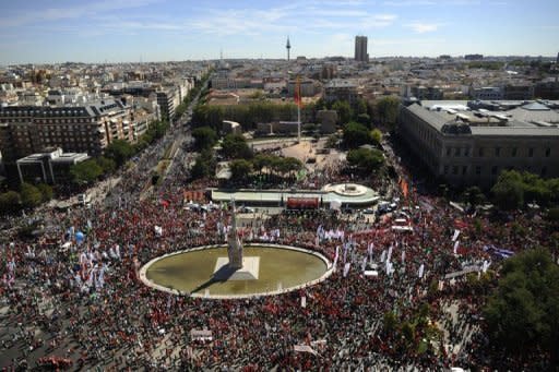 People take part in a demonstration against government austerity measures in Madrid. Over 1,000 buses had ferried people to the Spanish capital for the protest, which was organised by Spain's two leading trade unions, the CCOO and the UGT, along with roughly 150 smaller organisations