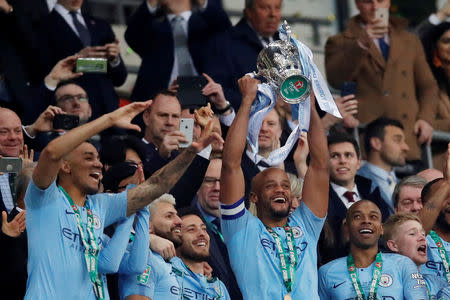 Soccer Football - Carabao Cup Final - Manchester City v Chelsea - Wembley Stadium, London, Britain - February 24, 2019 Manchester City's Vincent Kompany lifts the trophy at the end of the match REUTERS/David Klein