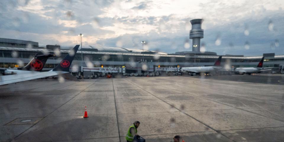 Ground crew load bags into an Air Canada plane departing from Pearson International Airport in Toronto, Ontario, Canada May 16,