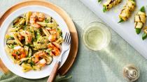 <p><strong>Recipe: <a href="https://www.southernliving.com/recipes/grilled-shrimp-squash-pasta" rel="nofollow noopener" target="_blank" data-ylk="slk:Grilled Shrimp-and-Squash Pasta with Summer Herbs;elm:context_link;itc:0;sec:content-canvas" class="link ">Grilled Shrimp-and-Squash Pasta with Summer Herbs</a></strong></p> <p>Grilled shrimp and in-season squash is a summer duo made for warm-weather dinners. Top with a sprinkling of Parmesan or crumbled feta cheese for the ultimate finishing touch. </p>