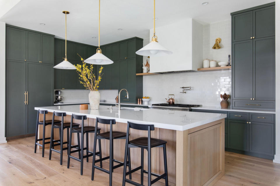 A modern kitchen island with an integrated sink.<p>Houzz / Nuela Designs, Avery Nicole Photography</p>