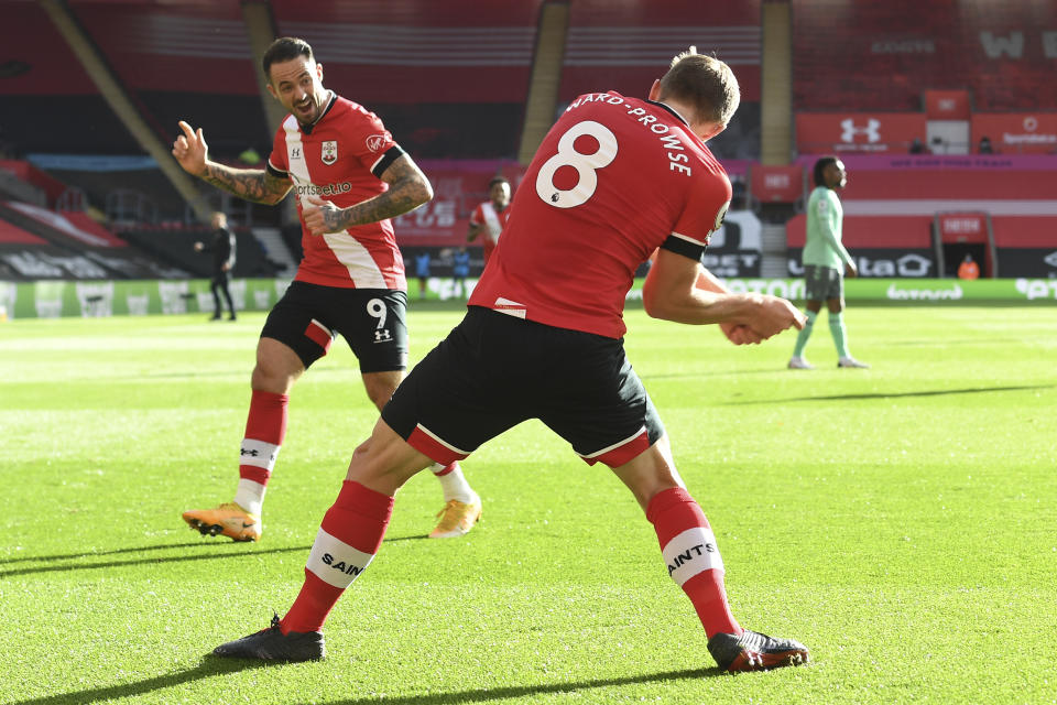 Southampton's James Ward-Prowse, right, celebrates with Southampton's Danny Ings after scoring his side's opening goal during an English Premier League soccer match between Southampton and Everton at the St. Mary's stadium in Southampton, England, Sunday Oct. 25, 2020. (Andy Rain/Pool via AP)