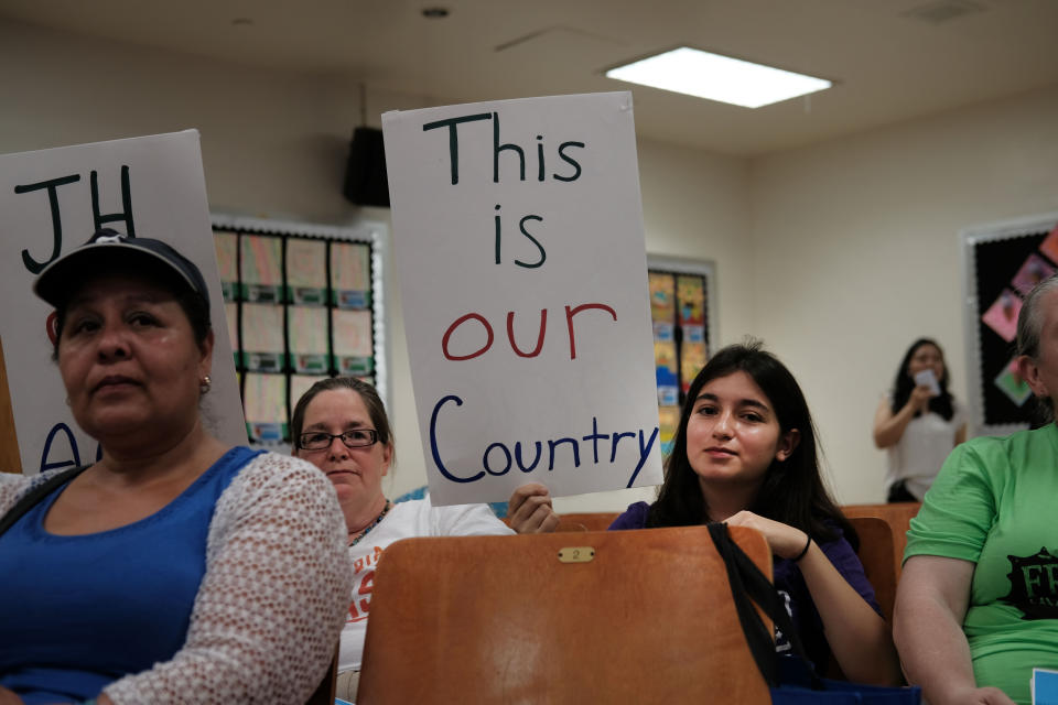 Some of Ocasio-Cortez's diverse constituents brought homemade signs to an immigration town hall on Saturday. (Photo: Spencer Platt/Getty Images)