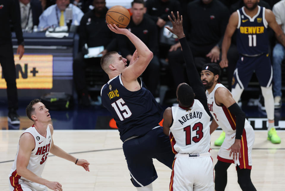 DENVER, COLORADO - JUNE 04: Nikola Jokic #15 of the Denver Nuggets shoots the ball over Bam Adebayo #13 of the Miami Heat during the fourth quarter in Game Two of the 2023 NBA Finals at Ball Arena on June 04, 2023 in Denver, Colorado. NOTE TO USER: User expressly acknowledges and agrees that, by downloading and or using this photograph, User is consenting to the terms and conditions of the Getty Images License Agreement. (Photo by Matthew Stockman/Getty Images)