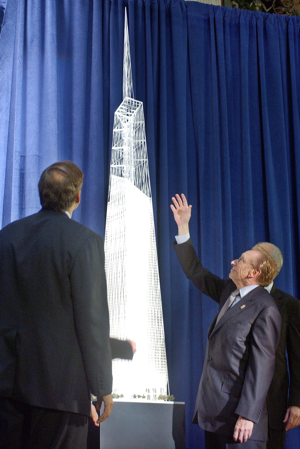 NEW YORK – DECEMBER 19: New York Governor George Pataki (L), leaseholder Larry Silverstein (R) and architect David Childs (partially obscured) look at a model of the New Freedom Tower December 19, 2003 at Federal Hall in <a class="link " href="https://sports.yahoo.com/soccer/teams/new-york-city-fc/" data-i13n="sec:content-canvas;subsec:anchor_text;elm:context_link" data-ylk="slk:New York City;sec:content-canvas;subsec:anchor_text;elm:context_link;itc:0">New York City</a>. The Freedom Tower will be built on the World Trade Center site and will rise 1,776 feet intio the sky becoming the world’s tallest building. The building will contain 2.6 million square feet of office space on 60 stories and the top floors will house roof top restaurants and a public observation deck. (Photo by Stephen Chernin/Getty Images)