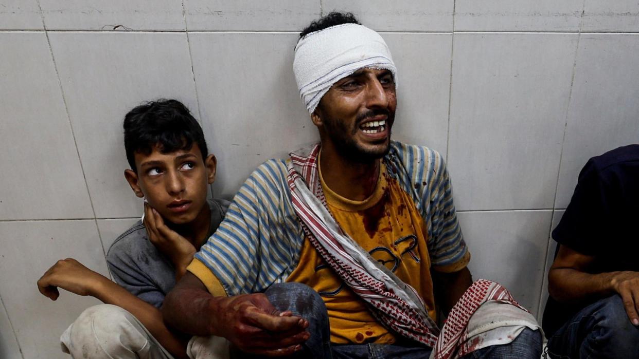 A man reacts at Nasser hospital in Khan Younis following a reported Israeli air strike on a camp for displaced people, in the southern Gaza Strip (9 July 2024)