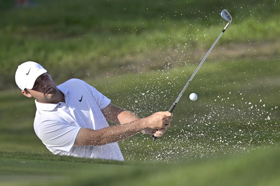 Scottie Scheffler hits out of a bunker onto the 17th green during the third round of the Workday Championship golf tournament Saturday, Feb. 27, 2021, in Bradenton, Fla. (AP Photo/Phelan M. Ebenhack)