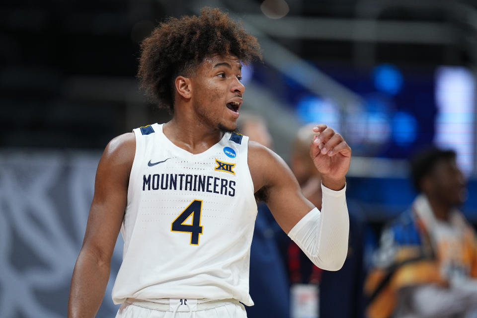 INDIANAPOLIS, IN - MARCH 21: Miles McBride #4 of the West Virginia Mountaineers smiles against the Syracuse Orange in the second round of the 2021 NCAA Division I Mens Basketball Tournament held at Bankers Life Fieldhouse on March 21, 2021 in Indianapolis, Indiana. (Photo by Jack Dempsey/NCAA Photos via Getty Images)