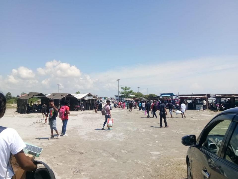 <div class="paragraphs"><p>Passengers waiting at the ghat.</p></div>