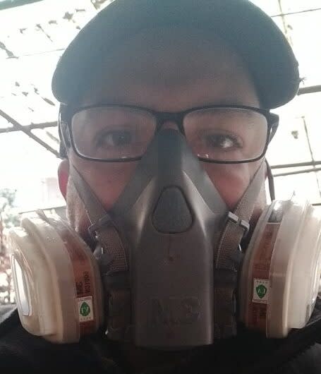 Chris Hill, 38, wearing a gas mask