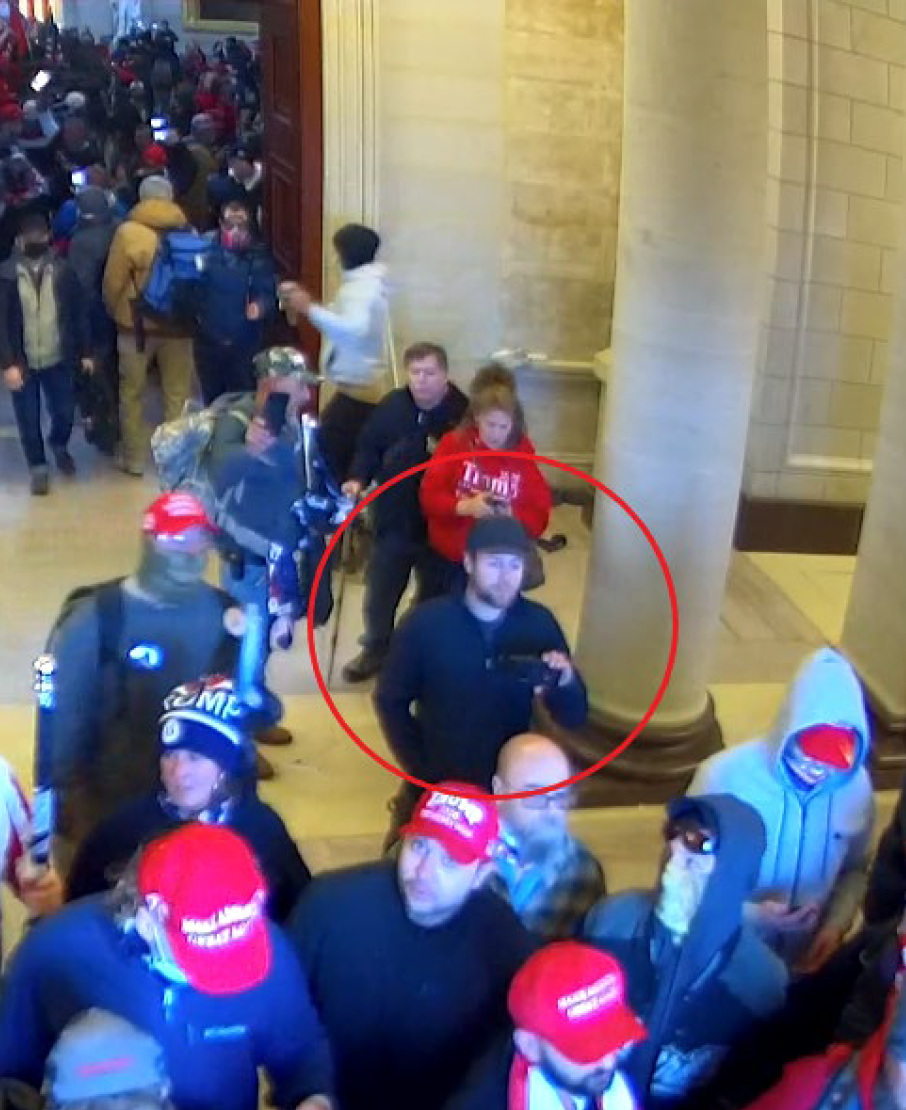 Tanner Bryce Sells can be seen in the red circle from this image from a security camera recording using a cellphone on Jan. 6, 2021, during the riot at the U.S. Capitol.