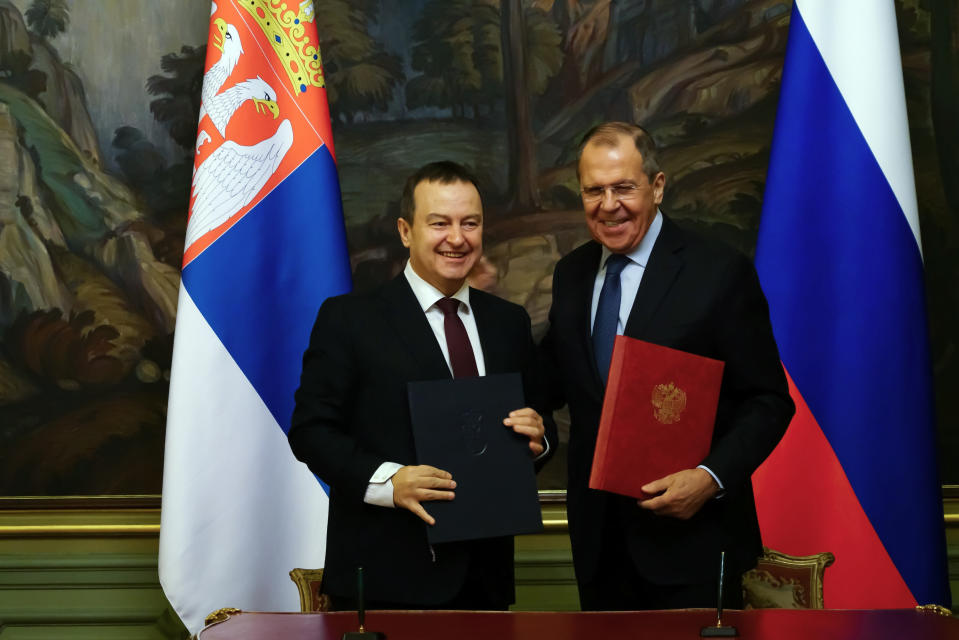 Russian Foreign Minister Sergey Lavrov, right, and Serbia's Foreign Minister Ivica Dacic pose for a photo after their talks in Moscow, Russia, Wednesday, April 17, 2019. Serbia is seeking an increased Russian role in the European Union-mediated talks with the former province of Kosovo, the move which could further strain the Balkan country's relations with the West. Serbia's Foreign Minister Ivica Dacic said after meeting his Russian counterpart Sergey Lavrov on Wednesday, April 17 in Moscow that "Serbia cannot defend its state interests without the assistance of the Russian Federation." (Serbia Russia Kosovo via AP)