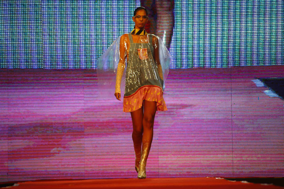 A model presents a creation by Clandestina during a fashion show in Havana, Cuba, Thursday, Nov. 15, 2018. The initiative combines fashion design by Cuban entrepreneurs of the Clandestina brand with the backing of United States tech giant Google that is looking to develop the access to the internet to a country with low connectivity. (AP Photo/Desmond Boylan)