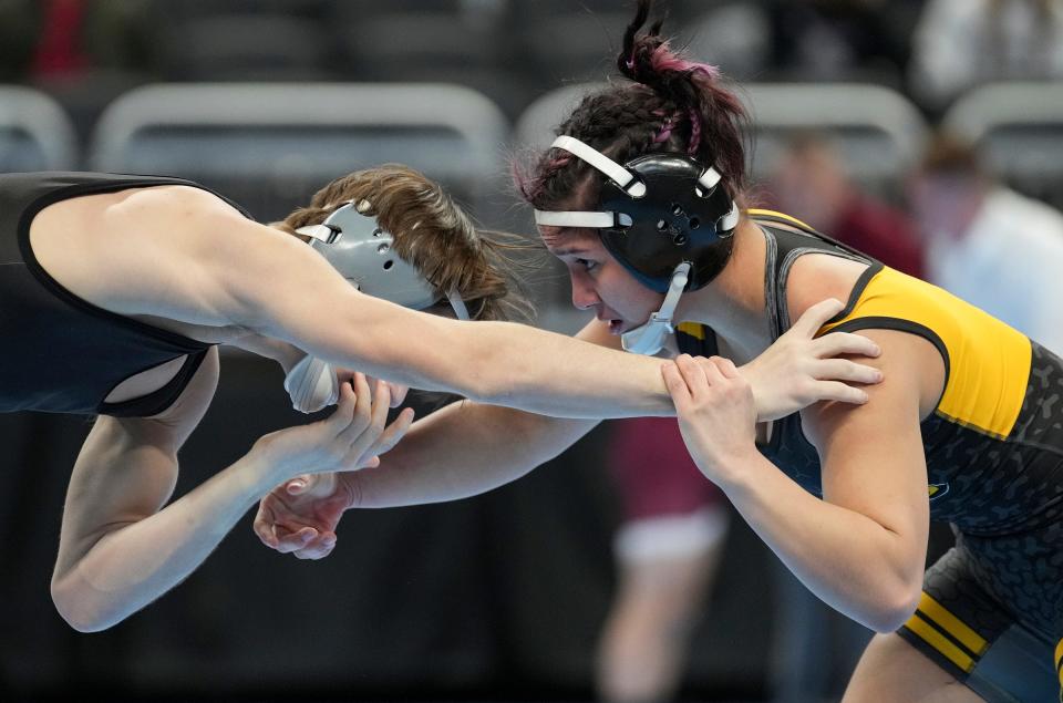 Bloomington South High School sophomore Cameron Meier and Fort Wayne Snider High School sophomore Julianna Ocampo wrestle in a 106-pound match Friday, Feb. 17, 2023, during IHSAA wrestling state final preliminaries at Gainbridge Fieldhouse in Indianapolis. 