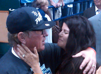 Tampa Bay manager Joe Maddon hugs his wife, Jaye, after the Rays' 8-7 extra-innings victory over the Yankees