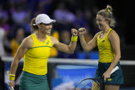 Storm Sanders, right, and Samantha Stosur of Australia gesture as they play Alicia Barnett and Olivia Nicholls of Britain, during the semi-finals match, of the Billie Jean King Cup tennis tournament, at the Emirates Arena in Glasgow, Scotland, Saturday, Nov. 12, 2022. (AP Photo/Kin Cheung)