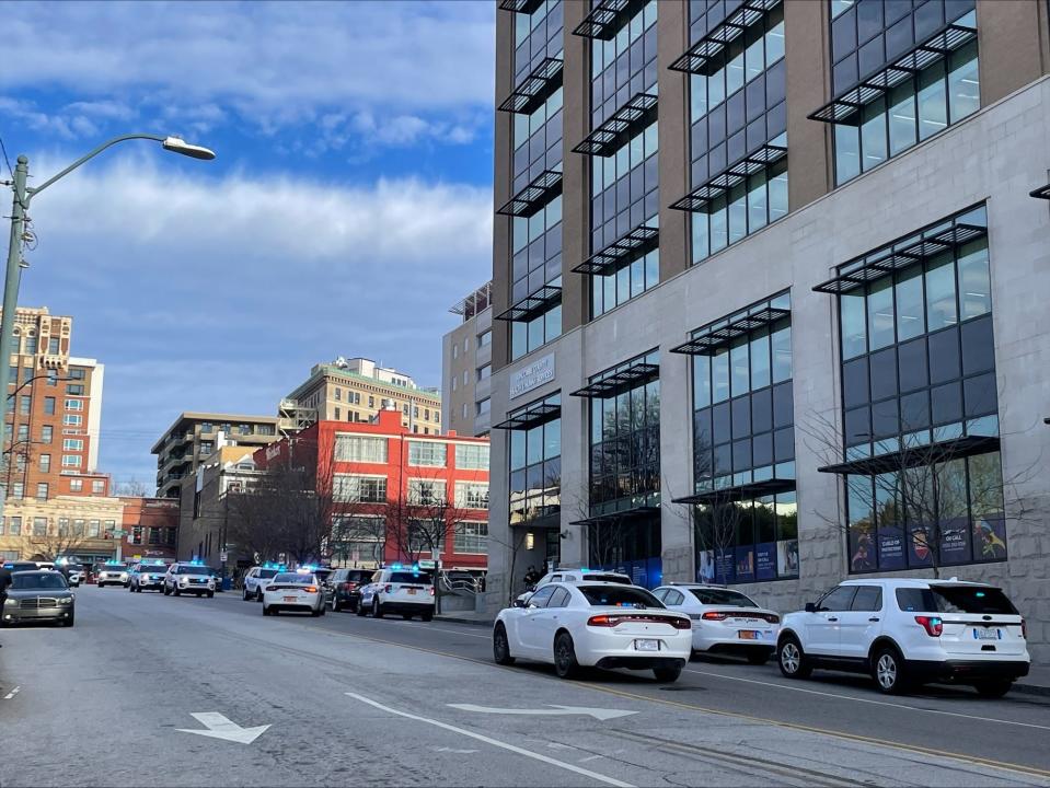 An increased law enforcement presence seen downtown near 40 Coxe Ave. following reports of an active shooter Dec. 20, 2023. The scene was cleared without injury or evidence of a shooter.