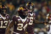 Minnesota running back Mohamed Ibrahim, center, reacts with teammates after scoring a touchdown against Nebraska during an NCAA college football game Saturday, Oct. 12, 2019, in Minneapolis. (AP Photo/Stacy Bengs)