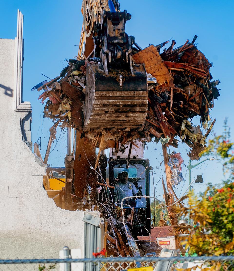 Weeks after the north half of the former empire theater was torn down, efforts restarted to demolish the rest of building on Nov. 20, 2023. The building was damaged by fires in 2018 and 2021.