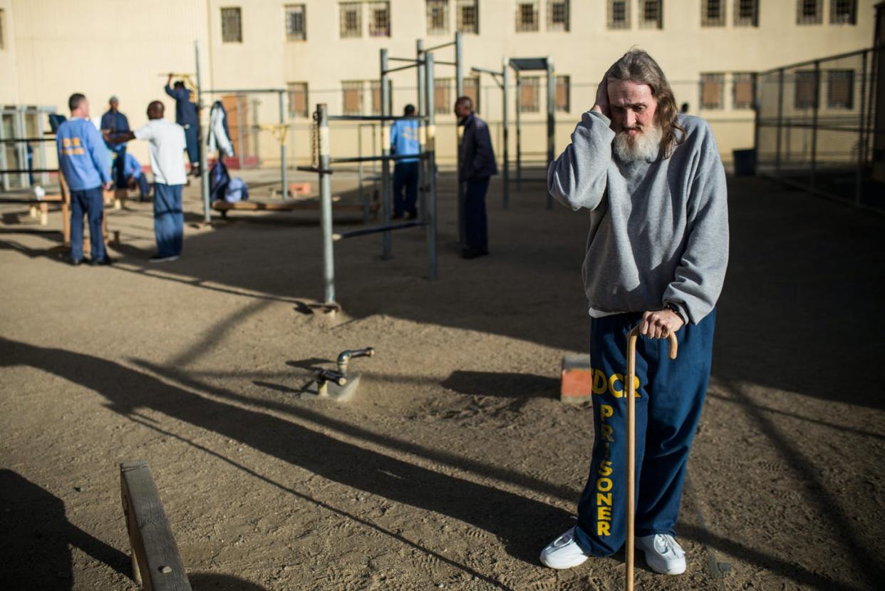 <span class="caption">An inmate at California Men's Colony prison.</span> <span class="attribution"><a class="link " href="https://www.gettyimages.com/detail/news-photo/frank-fuller-age-66-stands-alone-in-the-prison-yard-during-news-photo/458007523?adppopup=true&uiloc=thumbnail_more_from_this_event_adp" rel="nofollow noopener" target="_blank" data-ylk="slk:Andrew Burton/Getty Images;elm:context_link;itc:0;sec:content-canvas">Andrew Burton/Getty Images</a></span>