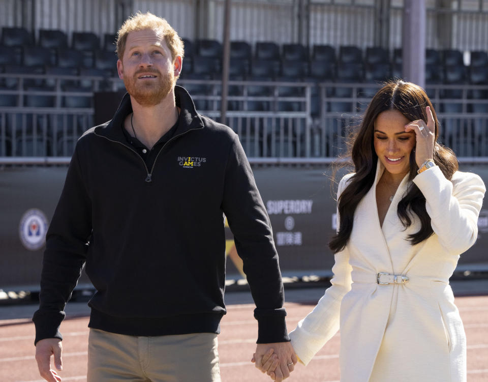 FILE - Prince Harry and Meghan Markle, Duke and Duchess of Sussex at the Invictus Games in The Hague, Netherlands, Sunday, April 17, 2022. A spokesperson for Prince Harry and his wife Meghan says the couple were involved in a car chase while being followed by photographers. The couple’s office says the pair and Meghan’s mother were followed for more than two hours by a half-dozen vehicles after leaving a charity event in New York on Tuesday, May 16, 2023. (AP Photo/Peter Dejong, File)