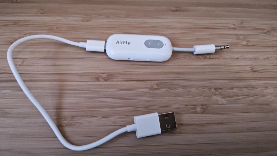 A white Twelve South AirFly Bluetooth transmitter sitting on a table