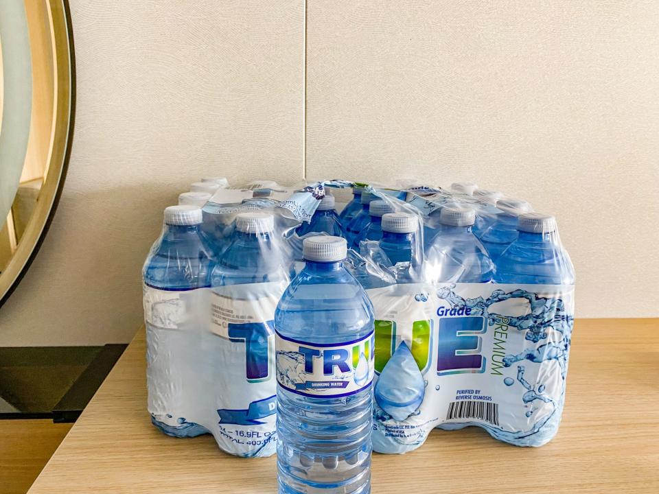 A case of water bottles in the author's stateroom on the world's largest cruise ship