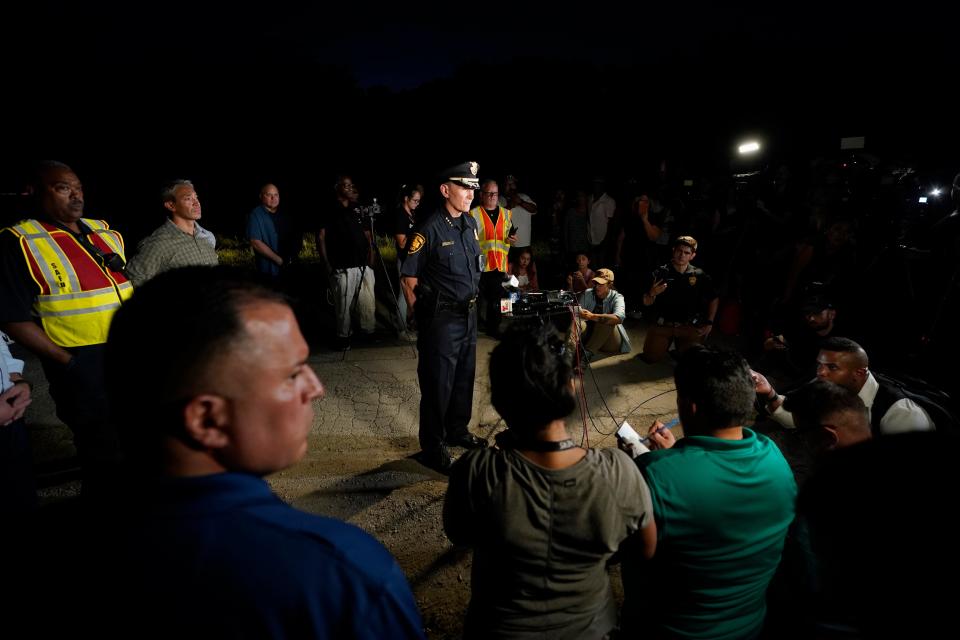 San Antonio Police Chief William McManus, center, briefs media and others at the scene where dozens of people were found dead and multiple others were taken to hospitals with heat-related illnesses after a semitrailer containing suspected migrants was found, Monday, June 27, 2022, in San Antonio (Copyright 2022 The Associated Press. All rights reserved)