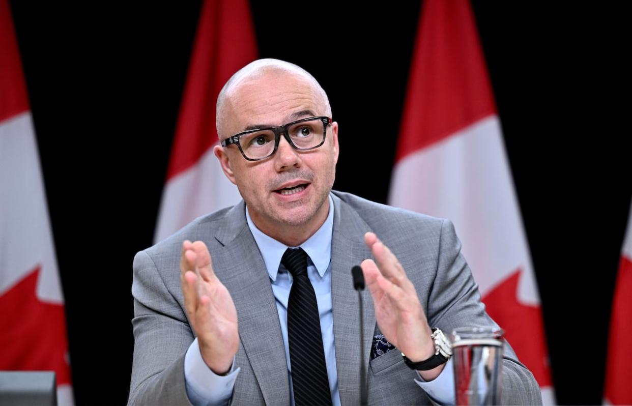 Alex Benay, Associate Deputy Minister at Public Services and Procurement Canada, spoke about the work to standardize and simplify HR and pay practices across the public service during a news conference on Tuesday. (Justin Tang/Canadian Press - image credit)